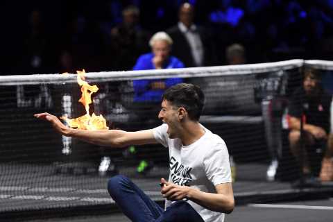 Bizarre moment idiot sets himself on FIRE before getting carried out by security at Laver Cup at O2 ..