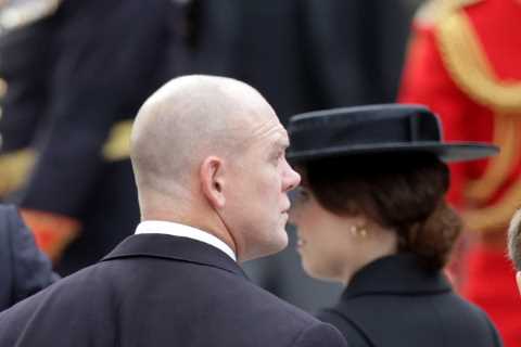 Touching moment Queen’s youngest grandson James, 14, is comforted by cousin-in-law Mike Tindall at..