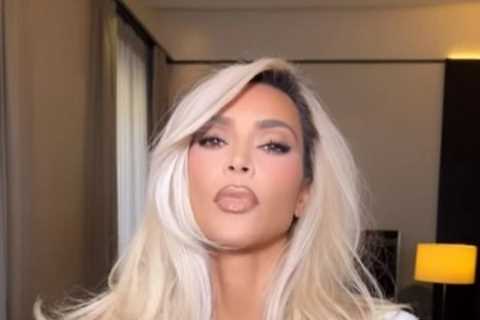 Kim Kardashian shows off her tiny waist in a tight white dress during Fashion Week in Milan after..