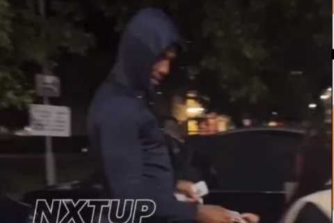 Anthony Joshua hands £20 notes from wad of cash to stunned kids in Watford on estate where he grew..