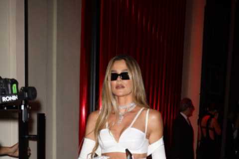 Khloe Kardashian shows off her thin waist in a tight cut-out dress as she parties with rumored new..