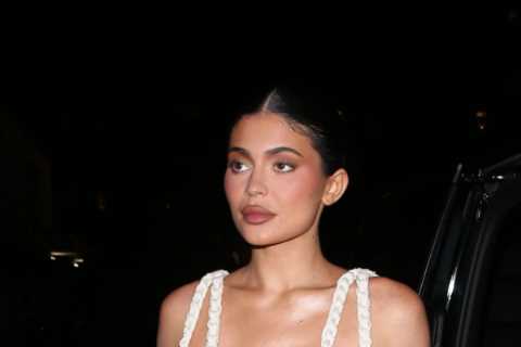 Kylie Jenner nearly suffers major NSFW wardrobe malfunction as she spills out of low plunging..