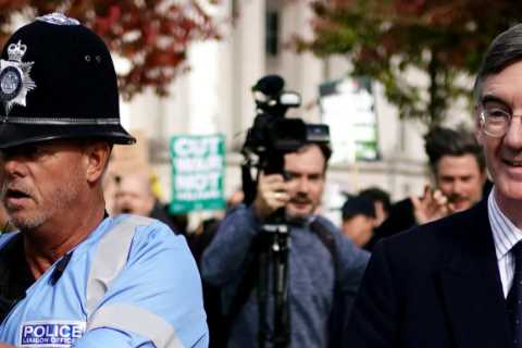 Tory MPs escorted by police while chased and pelted by leftie mob outside party conference in..