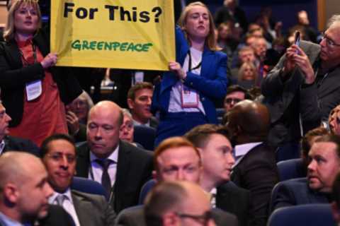 Eco activists ejected from the hall after interrupting Liz Truss’s conference speech