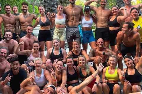 Love Island’s Adam Collard wraps his arms around two women in sports bras in Bali after Paige..