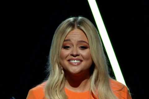 Emily Atack shows off stunning curves in an orange crop top and matching mini skirt on her ITV show