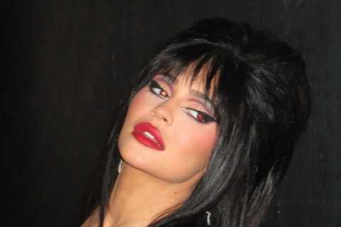 Kylie Jenner almost busts out of plunging tight dress as star channels Elvira in raunchiest..