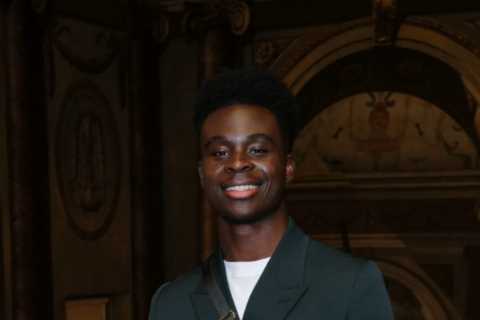 Bukayo Saka looks dapper as Arsenal star rubs shoulders with celebs at Dior’s star-studded..
