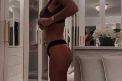 Christine McGuinness looks amazing as she strips down to her underwear and knee high boots