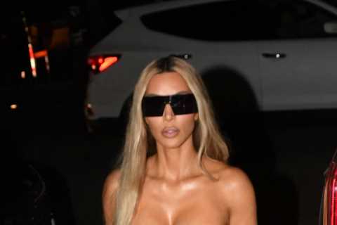 Kim Kardashian shows off major side boob and busts out of tiny strapless top while Khloe flaunts..
