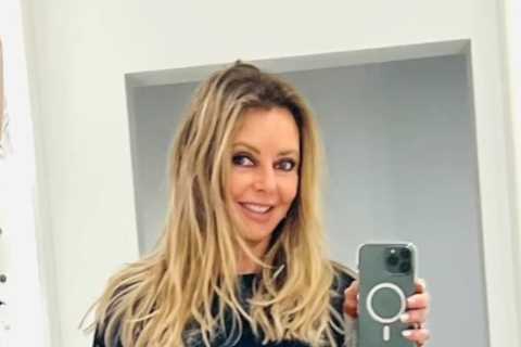 Carol Vorderman flashes toned legs in skintight leather trousers after pulling out of live TV..