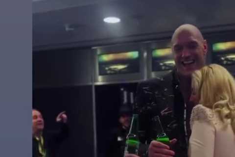 Watch Tyson Fury dance with wife Paris while holding a beer in dressing room after win over Derek..