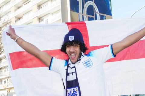Sun man Joe Hadden poses in England kit in front of Kylian Mpabbe’s old apartment block in Paris