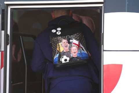 Jordan Pickford boards England team bus with custom family-themed backpack as he leaves Qatar hotel ..