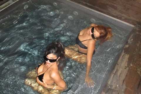 Kylie Jenner nearly slips out of tiny bikini as she relaxes in hot tub for new photos- but fans..