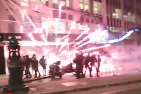 Moment riot cops struck by fireworks as violent clashes rock streets of France after nation beat..