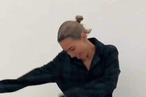 Kim Kardashian’s thin frame nearly drowns in oversized pajamas while showing off wild dance moves..