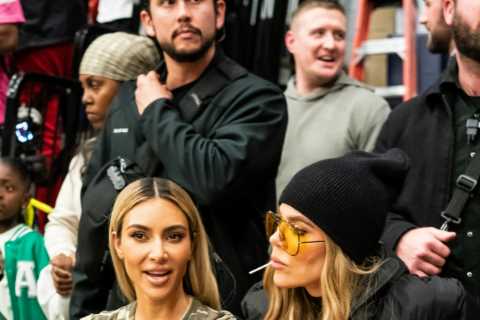 Kim Kardashian shows off her tiny waist in all-camouflage outfit for new photos- but fans blast..