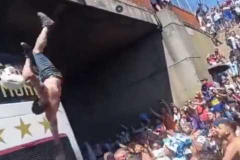 Argentina World Cup parade ABANDONED after fans leap off bridge to get into team bus in chaotic..
