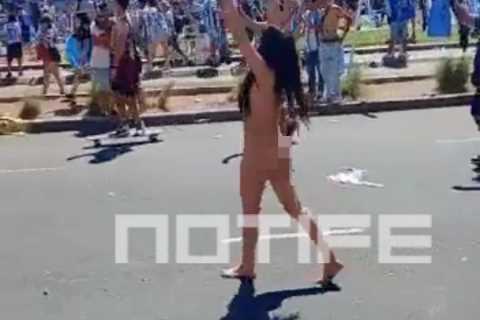 Watch as mystery brunette STRIPS NAKED to celebrate Argentina World Cup triumph in raucous Buenos..