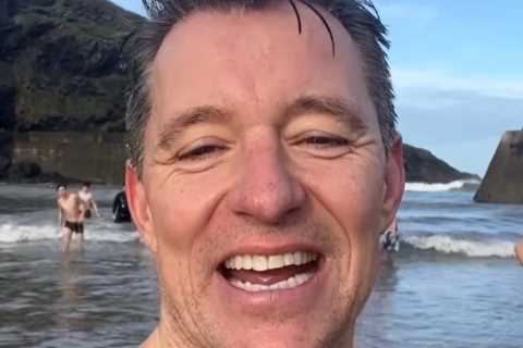 Topless Ben Shephard strips down to his trunks for freezing cold swim in the sea on Christmas..