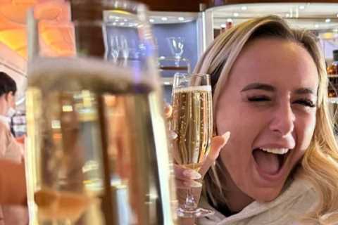 Love Island’s Millie Court downs five champagnes and flies first class on 14th holiday of the year..