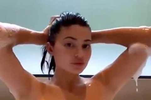 Kylie Jenner strips down and shows off her silky smooth legs in the bathtub for racy new video