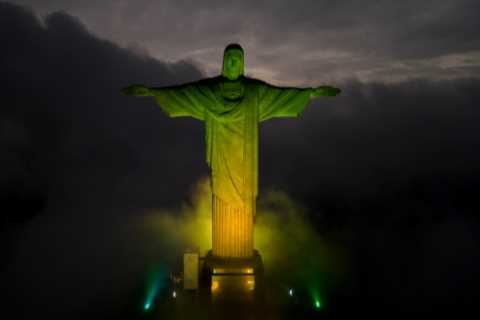 Brazil mourns death of hero Pele as Christ the Redeemer illuminated in green &amp; fans take to the ..