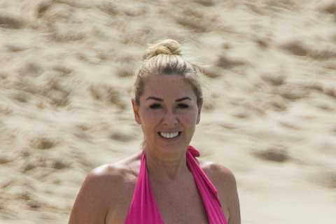 Claire Sweeney, 51, looks incredible as she hits the beach in Barbados in a bright pink swimsuit