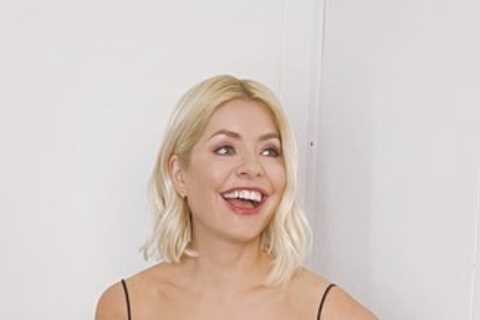Holly Willoughby looks stunning in plunging ballgown as she returns to host Dancing on Ice