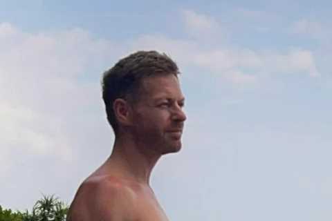 Hunky BBC weatherman drives fans wild as he poses topless on Bali beach and shows off rock-hard abs