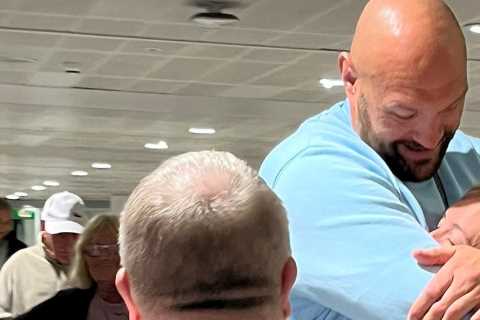 Tyson Fury hugs wife Paris at airport as he returns from family holiday in Tenerife to prepare for..