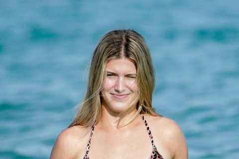 Tennis star Eugenie Bouchard strips down to leopard bikini as she puts Australian Open exit behind..