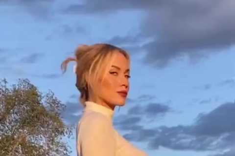 Watch Paige Spiranac’s driving technique as she smashes golf ball while wearing figure-hugging top..
