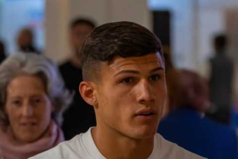 Dumped Love Island star Haris Namani looks downcast as he arrives back in the UK after shock punch..