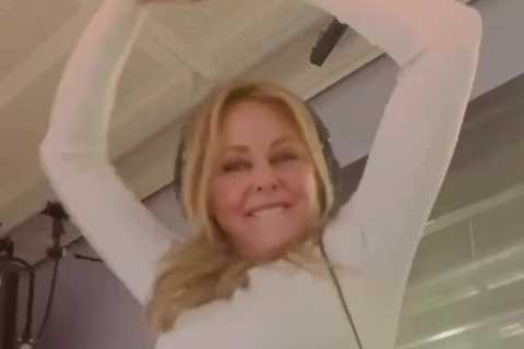 Carol Vorderman shows off impressive figure in tight-fitting leggings as she dances round radio..