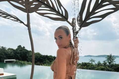 Love Island winner Millie Court flashes her bum in thong bikini as she heads on 14th holiday in a..