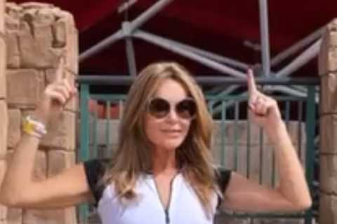 Amanda Holden looks incredible in a white wetsuit in Dubai as she braves an enormous water slide