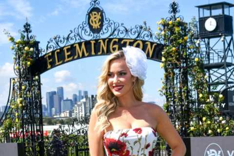 Paige Spiranac gets dressed up for glamorous day at the races after feeding baby kangaroo in..