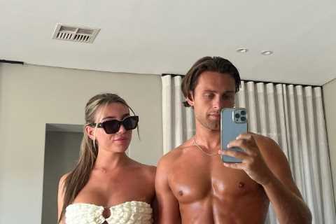 Love Island’s Casey O’Gorman shows off his ripped abs as he poses for snap with Rosie Seabrook..
