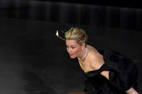 Elizabeth Banks suffers major Oscars blunder as she trips on-stage twice in embarrassing live TV..