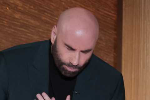 John Travolta breaks down in a puddle of tears on Oscars stage as he introduces Olivia..