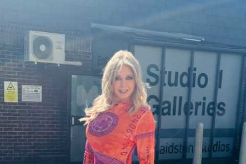 Carol Vorderman looks incredible as she shows off her curves in see-through red and orange dress