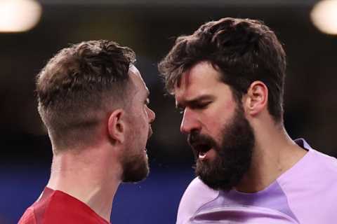 Watch Henderson shoulder charge Alisson in heated clash during Chelsea draw as Liverpool fans all..