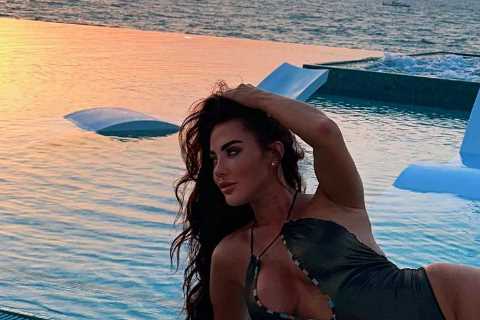 Towie star Yaz Oukhellou shows off her curves in plunging swimsuit