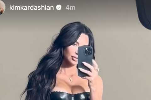 Kim Kardashian shows off skinny waist and goes pantless in just a loosely tied sarong and matching..