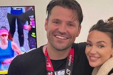 Michelle Keegan so proud as she celebrates with husband Mark Wright at the London Marathon finish..