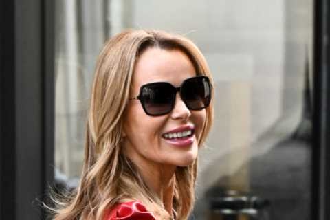 Amanda Holden goes braless in London’s Leicester Square as she gives away £1m