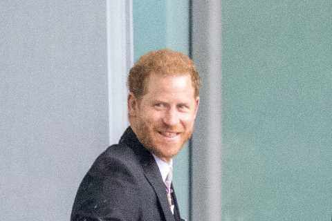 Prince Harry grins at Heathrow before jetting to LA just an hour after coronation as his family..