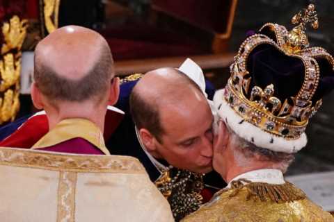 Prince William seals dad King Charles’ coronation with a kiss as he vows loyalty to his father